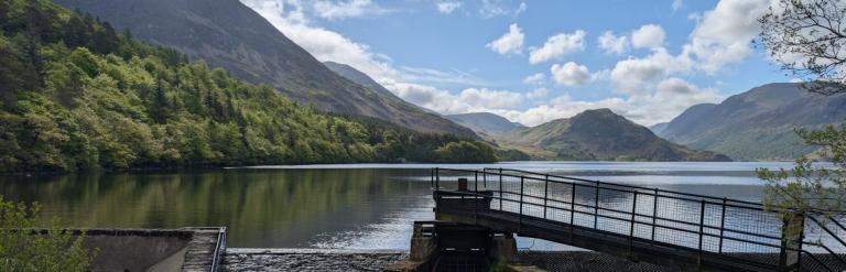 A lake and mountains in the daytime sunshine.