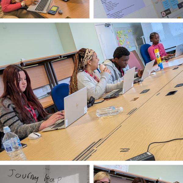 Students working on laptops and whiteboards in a bright, modern Council office